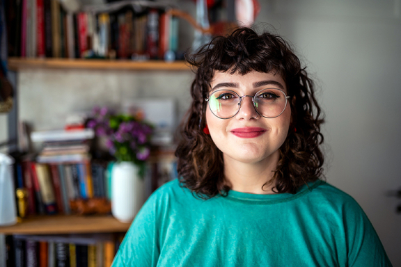 Smiling woman in green shirt