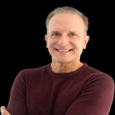 Headshot of smiling middle-aged adult with short hair 