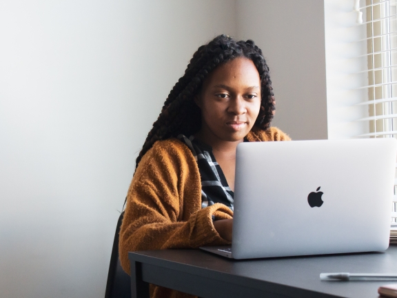 Person looks at laptop screen
