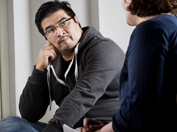 Counselor and adult client in Mobile Crisis services